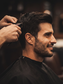 Barber layering products while cutting a client's hair